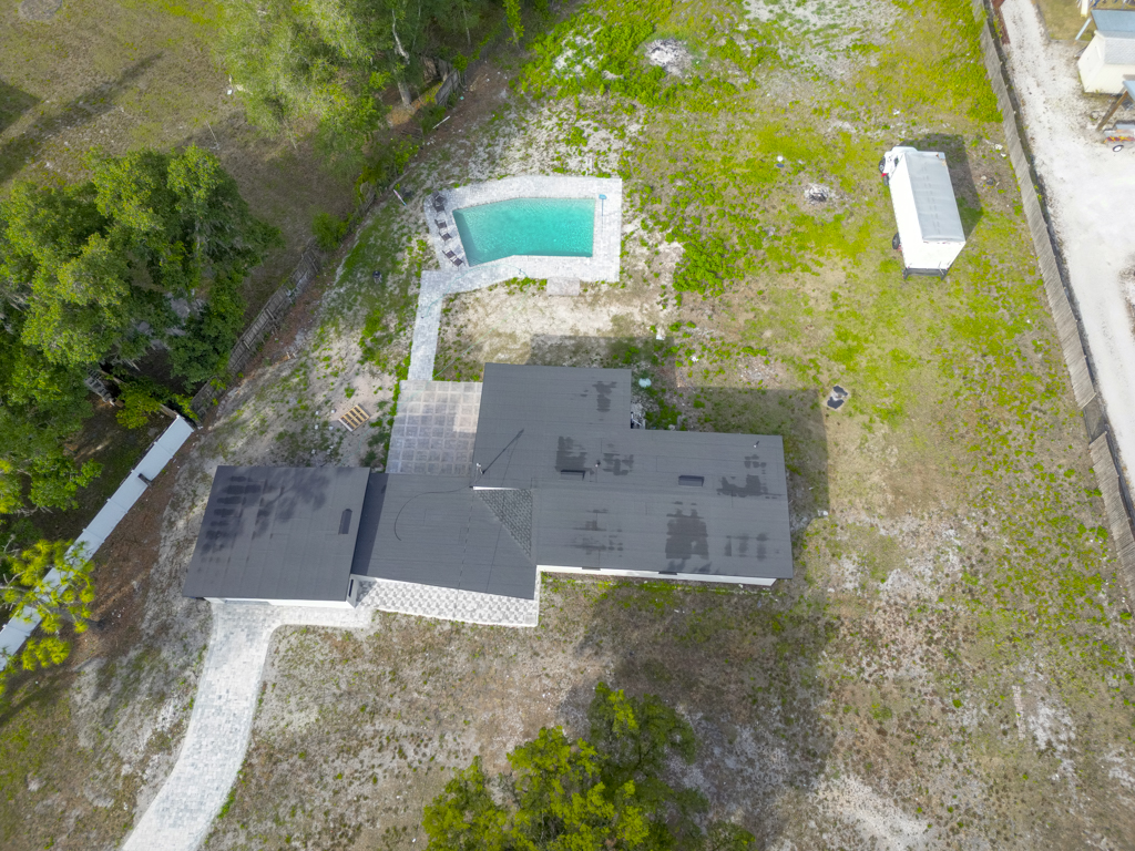 Aerial view of the pool and rear yard