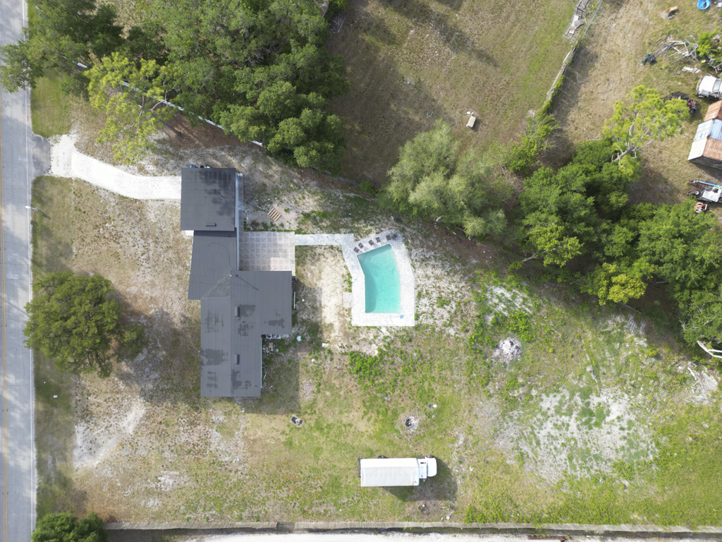 Aerial showing the drive and full lot