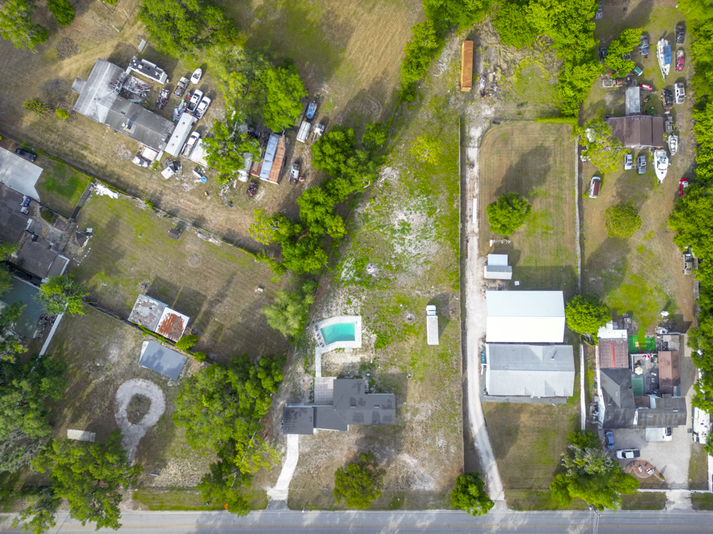 Wider aerial with surrounding parcels